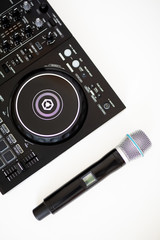  microphone and dj controller on a white background