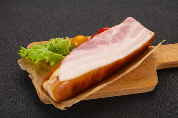 Smoked pork breast with salad leaves