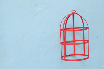 Red bird cage made of steel