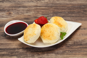 Curd pancakes with jam and stravberry
