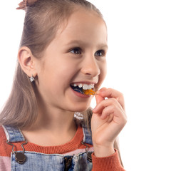 Little girl with orthodontics appliance isolated on white background.