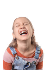 Obraz na płótnie Canvas Little girl with orthodontics appliance isolated on white background.