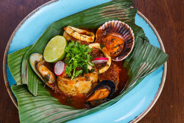 Bouillabaisse soup in the banana leaf