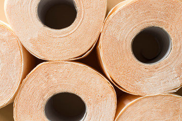 peach beige toilet paper pattern on beige background