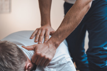 Physiotherapist treating patient for various physical ailments