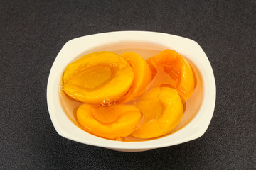 Marinated peaches fruit in the bowl