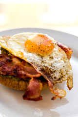 close up of avocado toast for breakfast with fried egg
