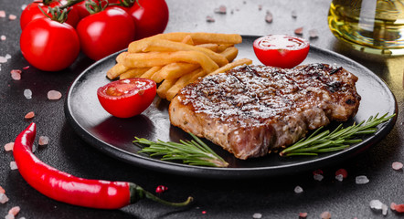 Ribeye steak with potatoes, onions and cherry tomatoes