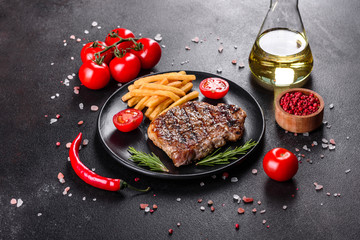 Ribeye steak with potatoes, onions and cherry tomatoes