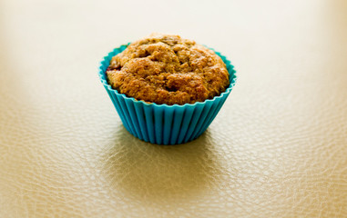 banana and raspberry muffin close up in the kitchen table