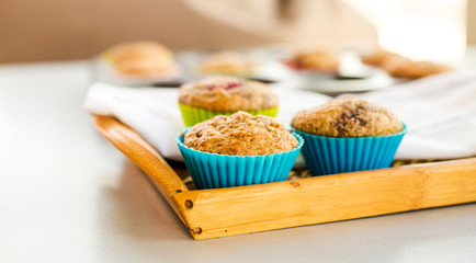 banana and raspberry muffin close up in the kitchen table