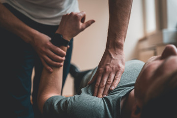 Physiotherapist treating patient for various physical ailments - obrazy, fototapety, plakaty
