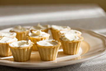 Tartlets with custard or cottage cheese.