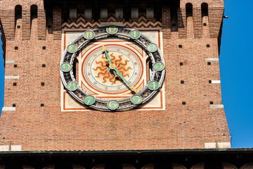 Castello Sforzesco. Extreme close up of the clock tower of the Sforza Castle (XV century), Milan, Lombardy, Italy, Europe
