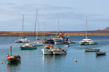 Fototapeta na wymiar Fishing boats in harbour at Palmeira on the island of Sal, Cape Verde