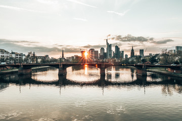 Fototapeta na wymiar sunlight shines trough Frankfurt skyscrapers at sunset