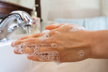 Women who wash their hands with gel or disinfectant with antibacterial soap after using the bathroom. Hygiene concept. prevent the spread of germs and bacteria and prevent corona virus infections