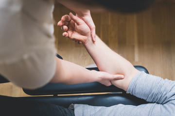 Physiotherapist treating patient for various physical ailments