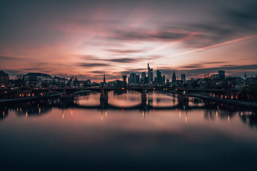 sunset over main river and Frankfurt skyline