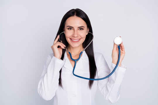 Photo of beautiful cheerful professional doc lady good mood friendly smiling patient using stethoscope to listen heart beat wear white lab coat isolated grey color background