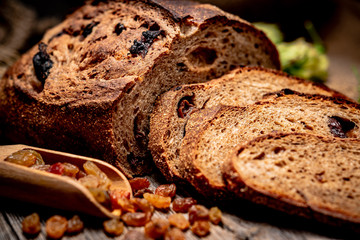 Freshly baked traditional bread on wooden table.