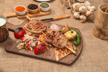Barbecue, grilled meat on wood table, saslik stock photo
