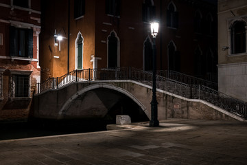 Fototapeta na wymiar Venice canal with gondolas at night. Italy. Empty Venice, No tourists