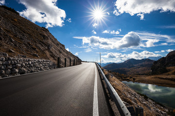 asphalt road in mountains. autumn landscape. Dolomites Alps, Italy