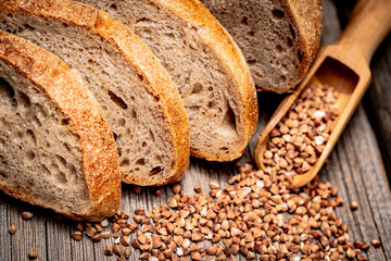 Freshly baked traditional bread on wooden table.