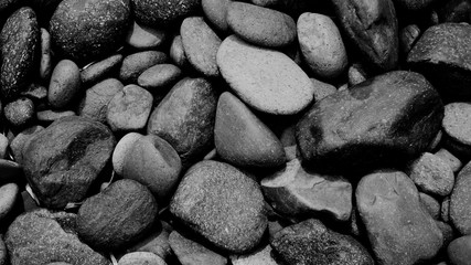 black stone background, pebbles on the beach