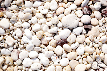 white stone background, pebbles on the beach