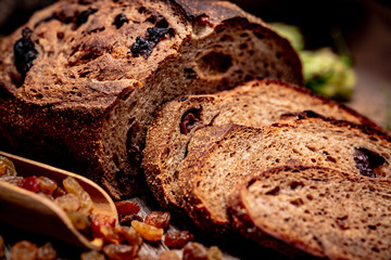 Freshly baked traditional bread on wooden table.