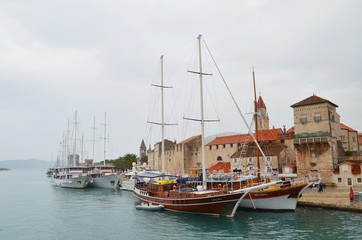 boats in the harbor of Trogir at a rainy day