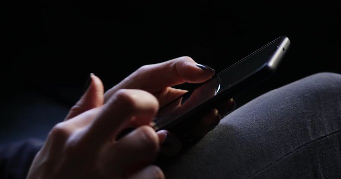 Closeup of Young Woman Hands Typing SMS Scrolling Pictures Phone