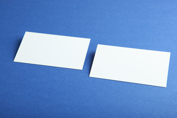 business cards on a colored background top view. Place to insert text