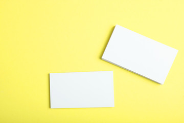 business cards on a colored background top view. Place to insert text