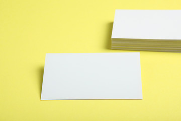 business cards on a colored background top view. Place to insert text