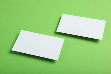 business cards on a colored background top view. Place to insert text