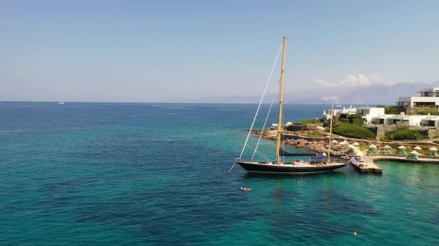 Aerial view of a yaht moored near Elounda beach, Crete, Greece