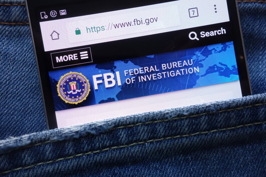 KONSKIE, POLAND - MAY 19, 2018: FBI (Federal Bureau of Investigation) website displayed on smartphone hidden in jeans pocket