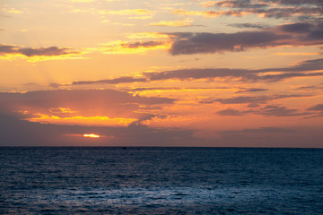 Fototapeta premium Dramatic sky over the sea at sunset