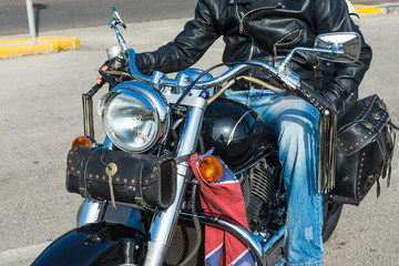 Biker on a black classic motorcycle
