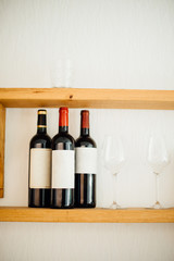 Tree bottle os wine on a shelf