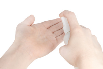 Naklejka premium bottle with antibacterial antiseptic spray in hand isolated on white background