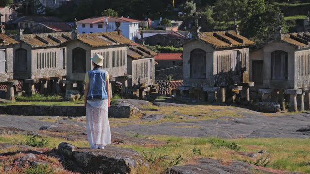 Woman tourist on Soajo settlement in Peneda Geres park.