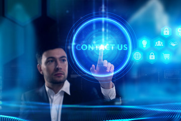 Business, Technology, Internet and network concept. Young businessman working on a virtual screen of the future and sees the inscription: Contact us