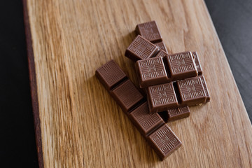 Chocolate slice on a wooden surface