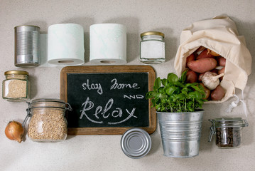 Flat lay of food supplies crisis for quarantine isolation period. Different glass jars with grains,...