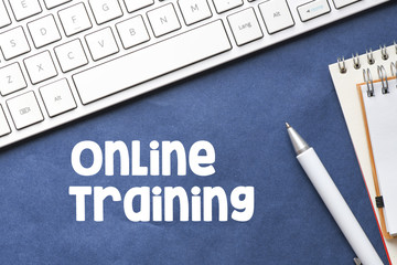 ONLINE TRAINING word in an office environment. The concept of business and education.