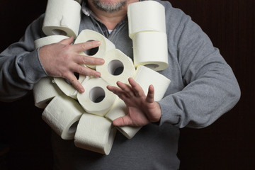 Toilet paper in man hands, coronavirus panic